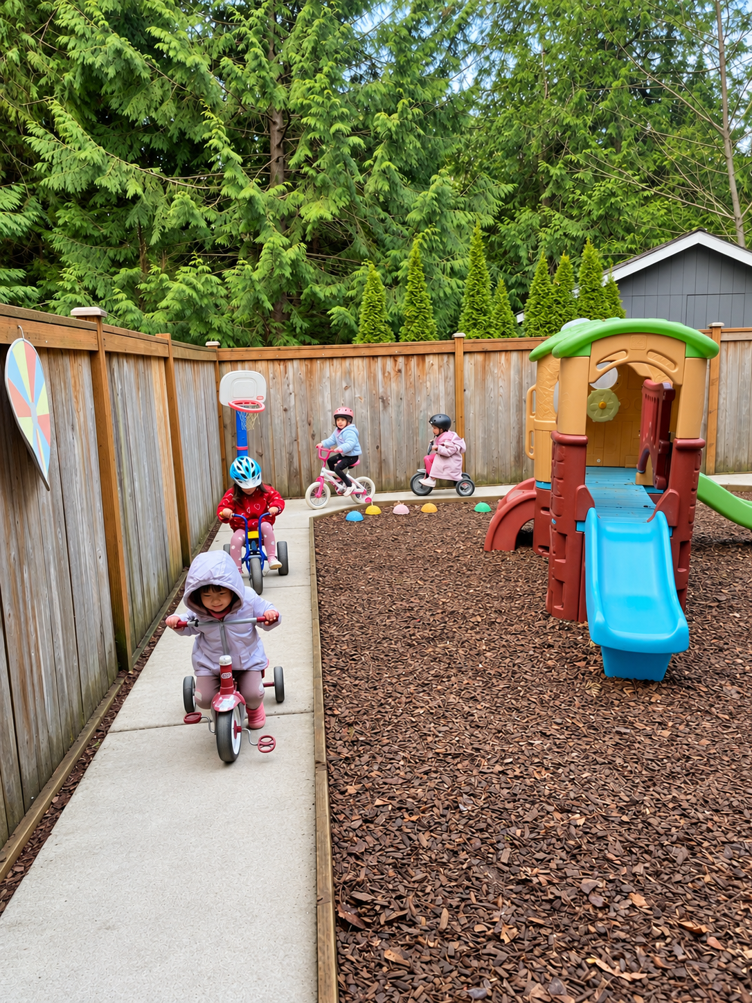 Children exploring and playing outdoors at Treehouse Academy